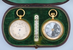 An antique barometer and compass travelling set in a green velvet box from Antique-watch.com